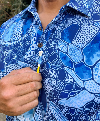 Kenny Flowers short sleeve blue honu golf polo in collaboration with Mauna Kea