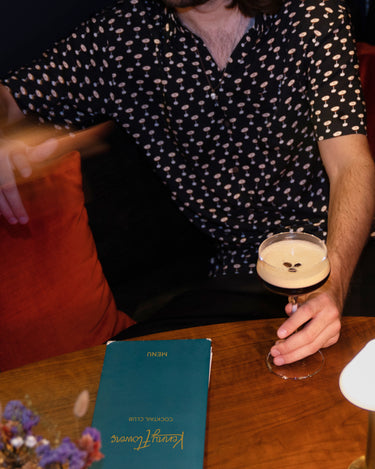 Kenny Flowers mens short sleeve button down espresso martini hawaiian shirt the buzz around town