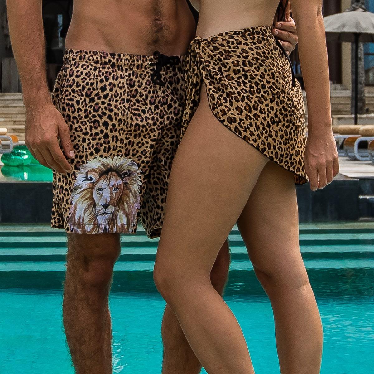 Animal print matching couples outfit with leopard print sarong and trunks by Kenny Flowers