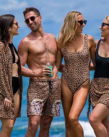 Animal print outfits by Kenny Flowers with leopard print kimono, trunks, one piece swimsuit, and sarong